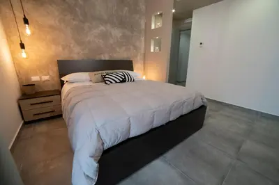 Letto o letti in una camera di Anna & Alfredo bed and breakfast