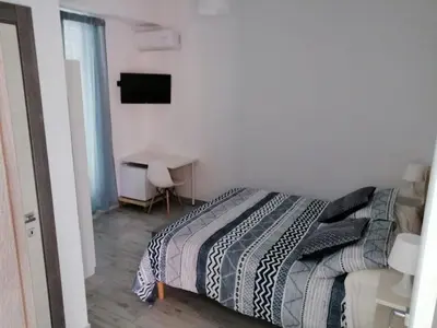 Letto o letti in una camera di UP&B Rooms Catania