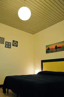 Letto o letti in una camera di Al Villino Sunrise appartamento in villa con piscina