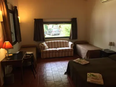 Letto o letti in una camera di Domus Verdiana