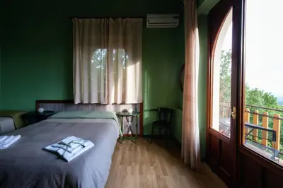 Letto o letti in una camera di Domus Verdiana