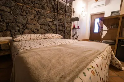 Letto o letti in una camera di B&B La Casetta