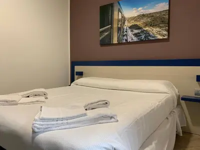 Letto o letti in una camera di Guesthouse Ughetti 21