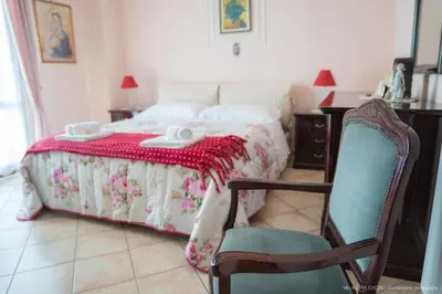 Letto o letti in una camera di Casa vacanze ETNA COCUS