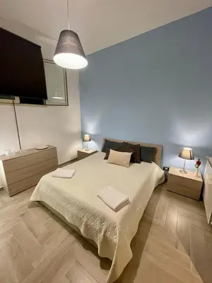 Letto o letti in una camera di Floris Home tra Mare e Montagna