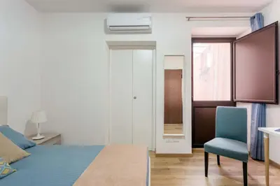 Letto o letti in una camera di Centre Apartment Grotte Bianche 2