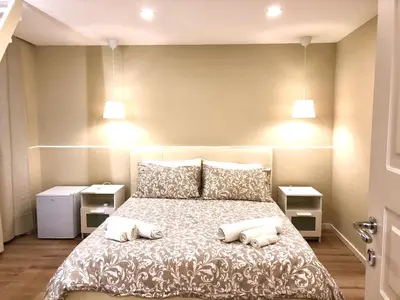 Letto o letti in una camera di Borgo Empedocle House