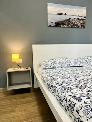 Letto o letti in una camera di Ambasciatori B&B