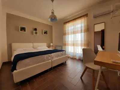 Letto o letti in una camera di Il Borghetto di San Giuseppe EtnaRooms&Apartments