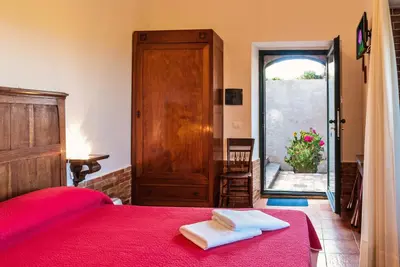 Letto o letti in una camera di Casale Poggio del Tiglio