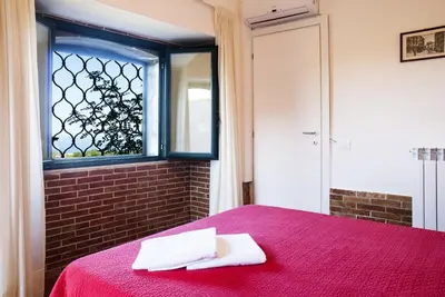 Letto o letti in una camera di Casale Poggio del Tiglio