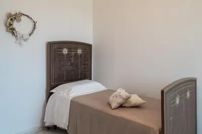 Letto o letti in una camera di Casa Rosario