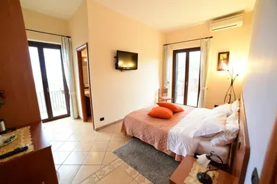 Letto o letti in una camera di B&B Dimora dell' Etna