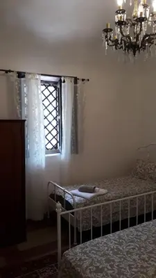 Letto o letti in una camera di Carrubo - Giardino in città