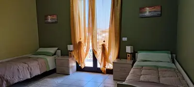 Letto o letti in una camera di B&B LAVIKA PEDARA