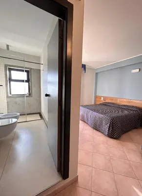 Letto o letti in una camera di Hotel Lachea