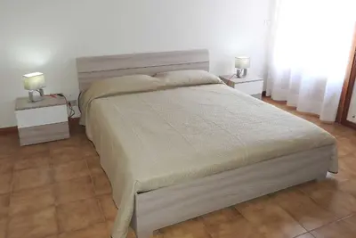 Letto o letti in una camera di Mansarda sul mare dei Ciclopi