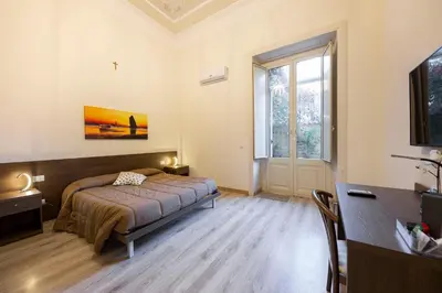 Letto o letti in una camera di B&B Ambitious