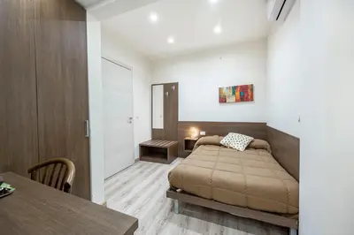 Letto o letti in una camera di B&B Ambitious