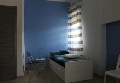 Letto o letti in una camera di b&b Appiddaveru