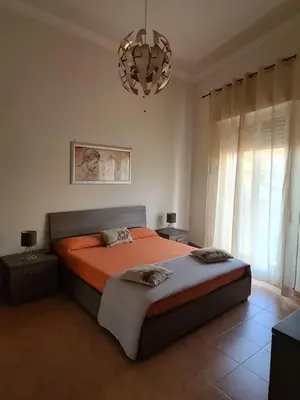 Letto o letti in una camera di Charme in Aci Castello