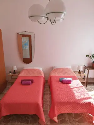 Letto o letti in una camera di At Claudio and Inna's Home
