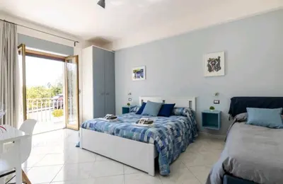 Letto o letti in una camera di B&B TERRA DI MITI