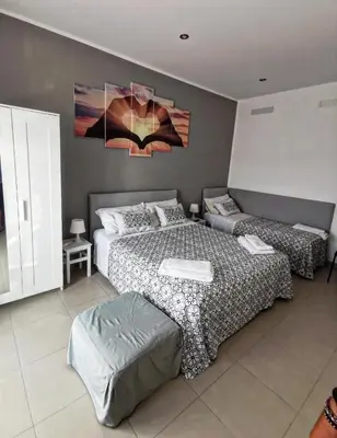 Letto o letti in una camera di Mariclà