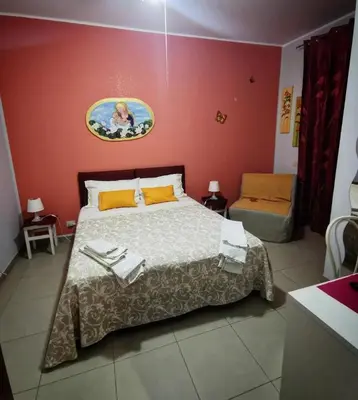Letto o letti in una camera di Mariclà