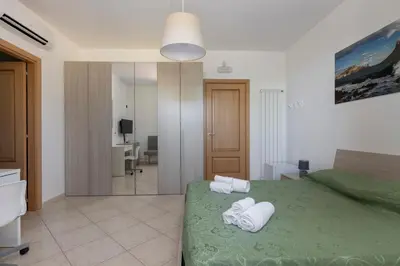 Letto o letti in una camera di Villa Vulcano, tra l'Etna e il mare