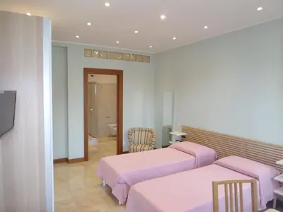 Letto o letti in una camera di b&b aurora