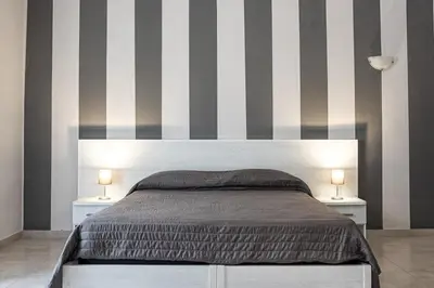 Letto o letti in una camera di Hotel Costanza