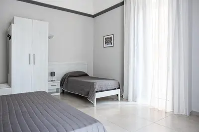 Letto o letti in una camera di Hotel Costanza