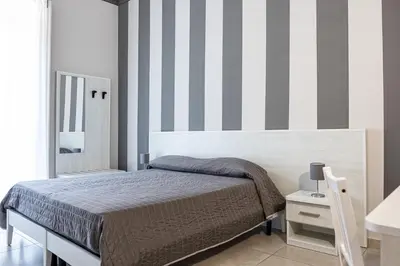 Letto o letti in una camera di Hotel Costanza