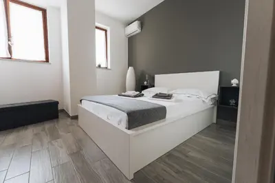 Letto o letti in una camera di Grey's Apartment