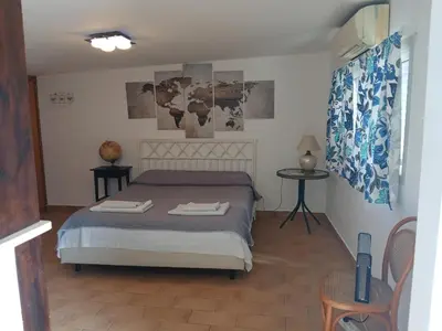 Letto o letti in una camera di Attico Scogliera d'Armisi