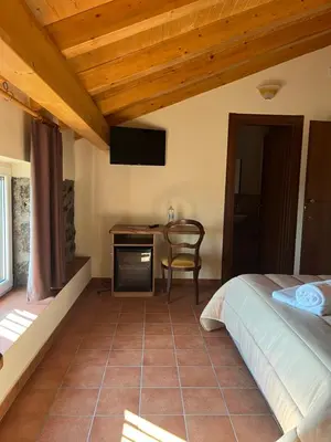 Letto o letti in una camera di Villa Casina dell'Etna