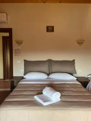 Letto o letti in una camera di Villa Casina dell'Etna