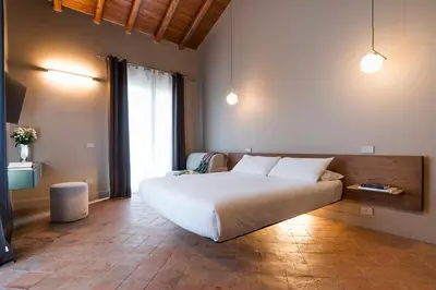 Letto o letti in una camera di Nèroli Bio Relais