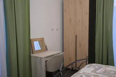 Letto o letti in una camera di B&B Giardino Bellini-centro