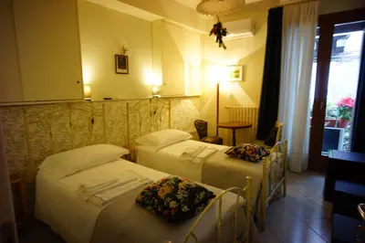 Letto o letti in una camera di Santa Caterina da Siena B&B