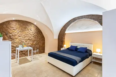 Letto o letti in una camera di GuestHost - Cerami Studio Flat