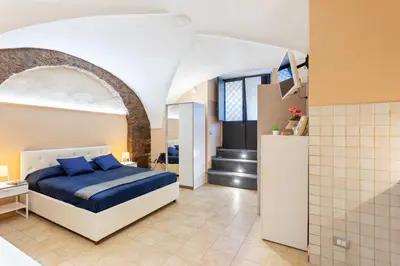 Letto o letti in una camera di GuestHost - Cerami Studio Flat
