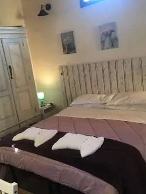 Letto o letti in una camera di La Mansarda-roof