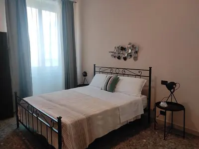 Letto o letti in una camera di Puccini Inn Catania centro