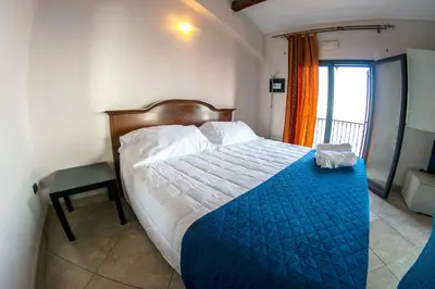 Letto o letti in una camera di Charming apartment in Capo Mulini with sea view - 50 m²