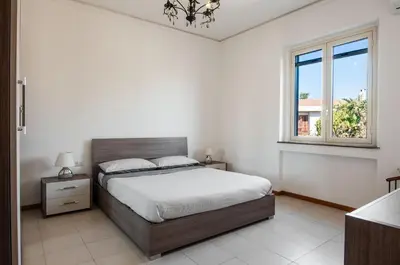 Letto o letti in una camera di Ortensia Apartments by Wonderful Italy