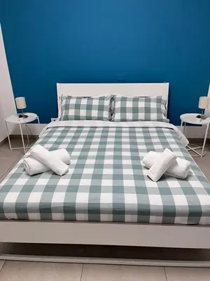 Letto o letti in una camera di Casa del Forestiero Umberto