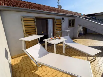 Area soggiorno di Apartment New Etna view by Interhome