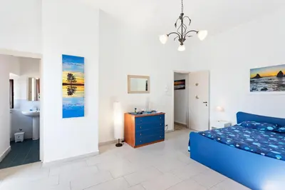 Letto o letti in una camera di GuestHost - La Finestra dei Ciclopi Seaview Flat